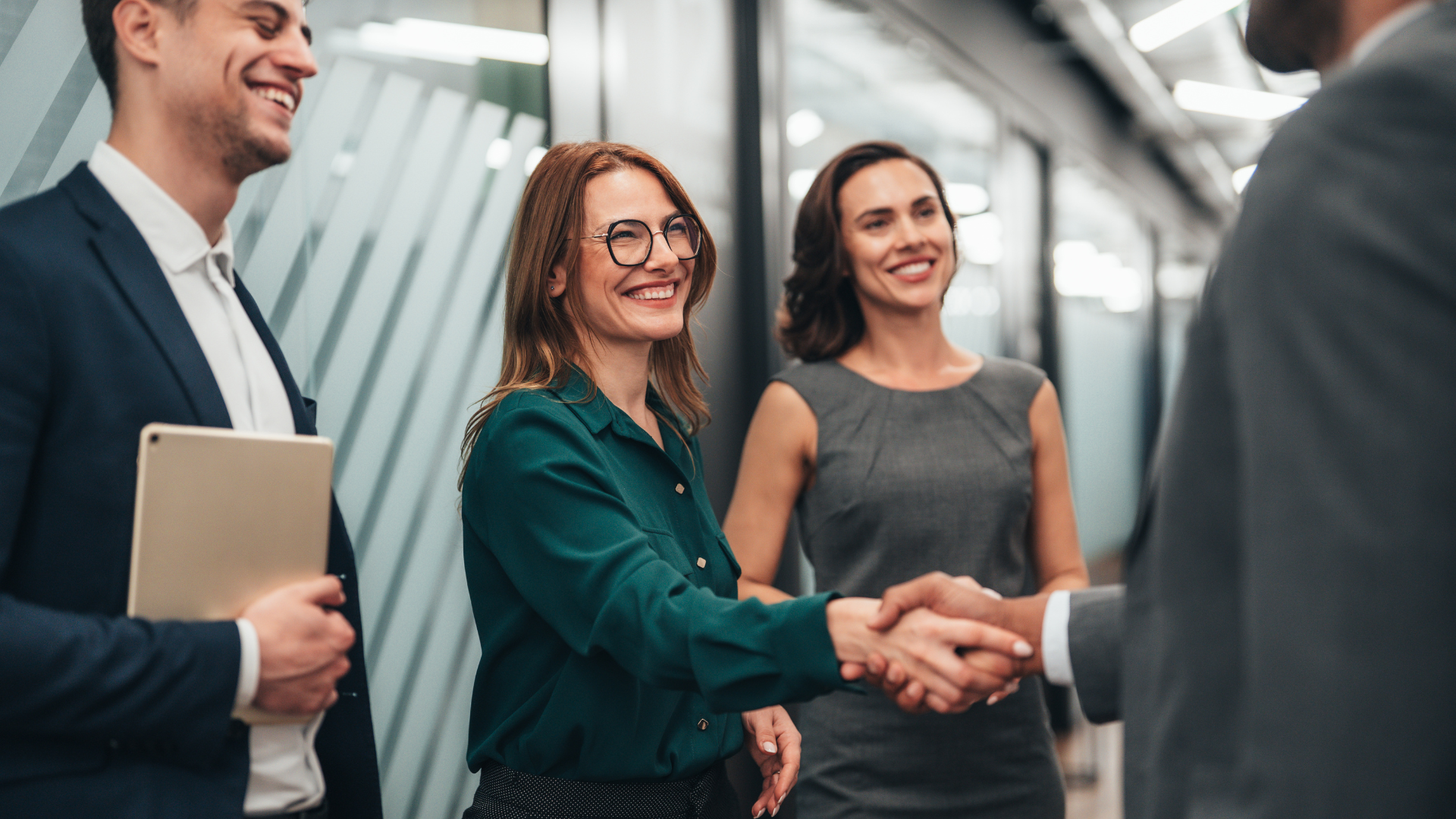 Business leaders shaking hands during a corporate transaction